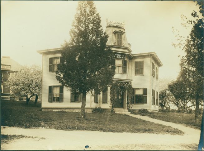 The Gibson-Bond House on Main Street is seen with a sign reading "Public Library".